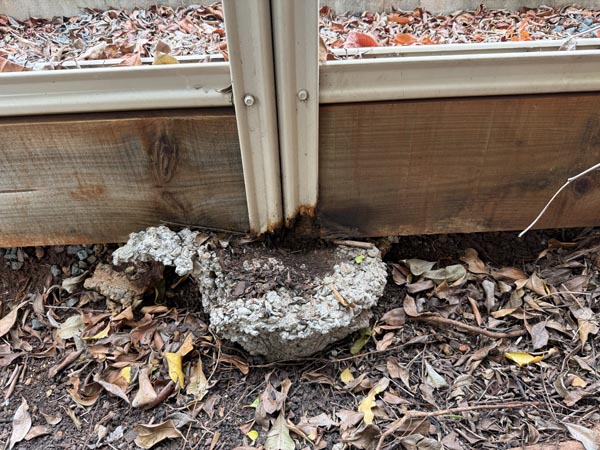 Failed corroded based of Colorbond fence panel due to poorly finished concrete pier