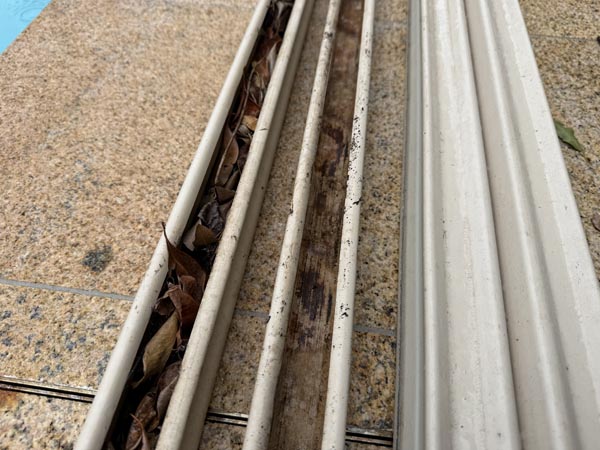 Leaf little in steel Colorbond fence rail track