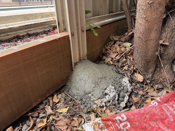Dome concrete finish to base of fence post