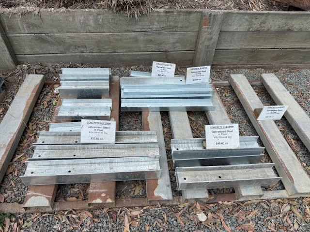 A variety of galvanised steel H posts compatible with 75mm wide concrete sleepers